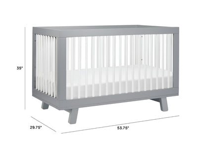 Modern gray baby crib with measurements labeled (35" height, 29.75" width, 53.75" length).
