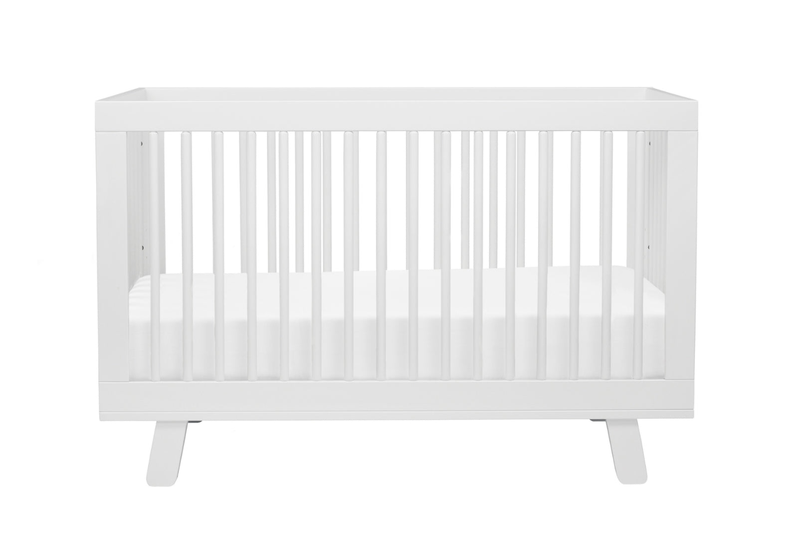 A modern white baby crib with a simple design and sturdy slats, isolated on a white background.