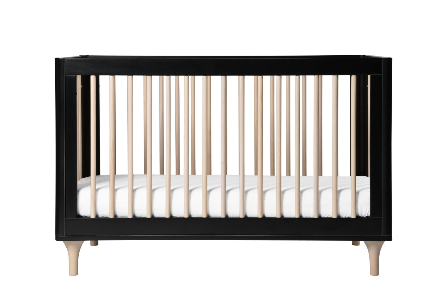 Modern black and natural wood crib with a white mattress, isolated on a white background.