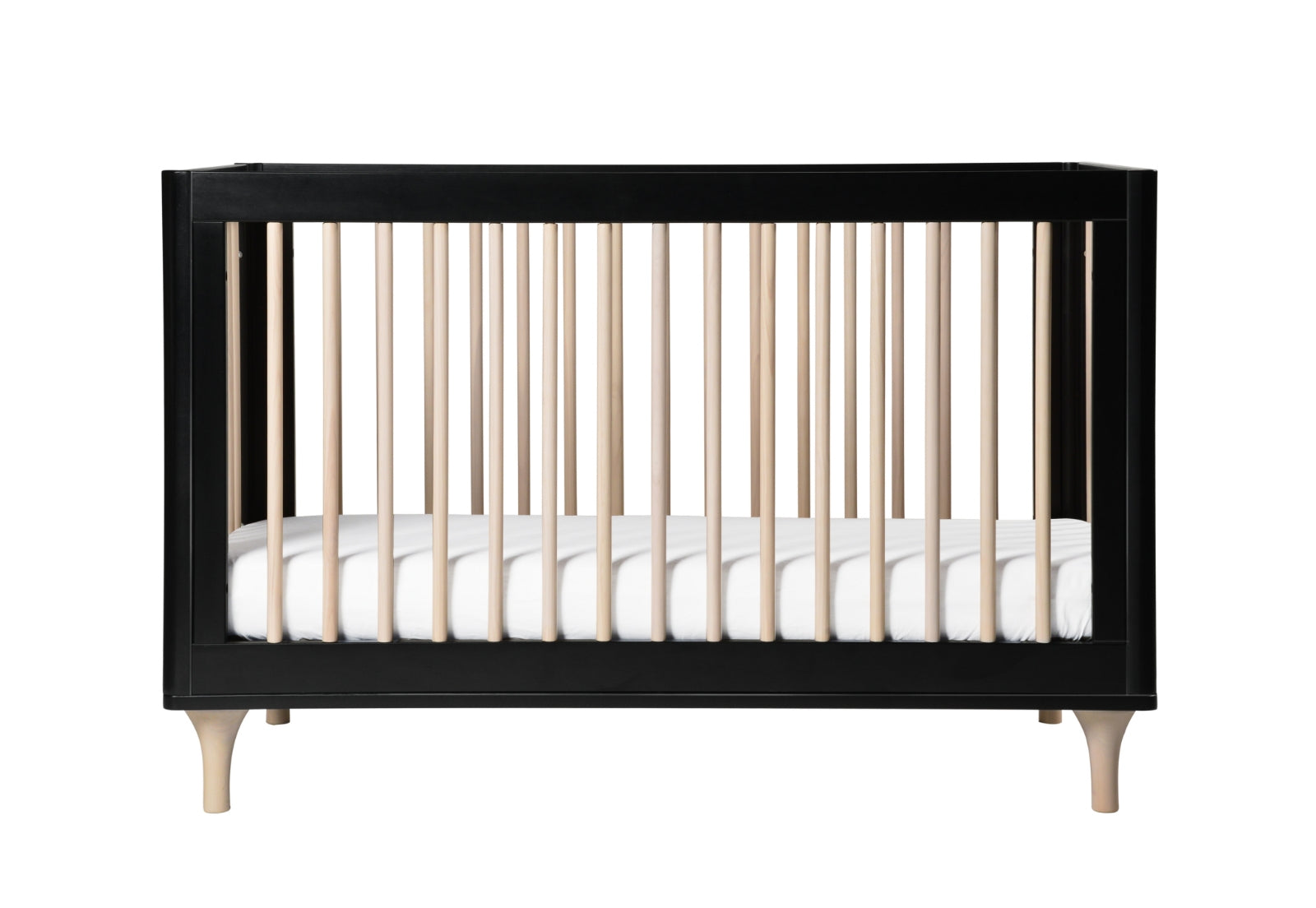 Modern black and natural wood crib with a white mattress, isolated on a white background.