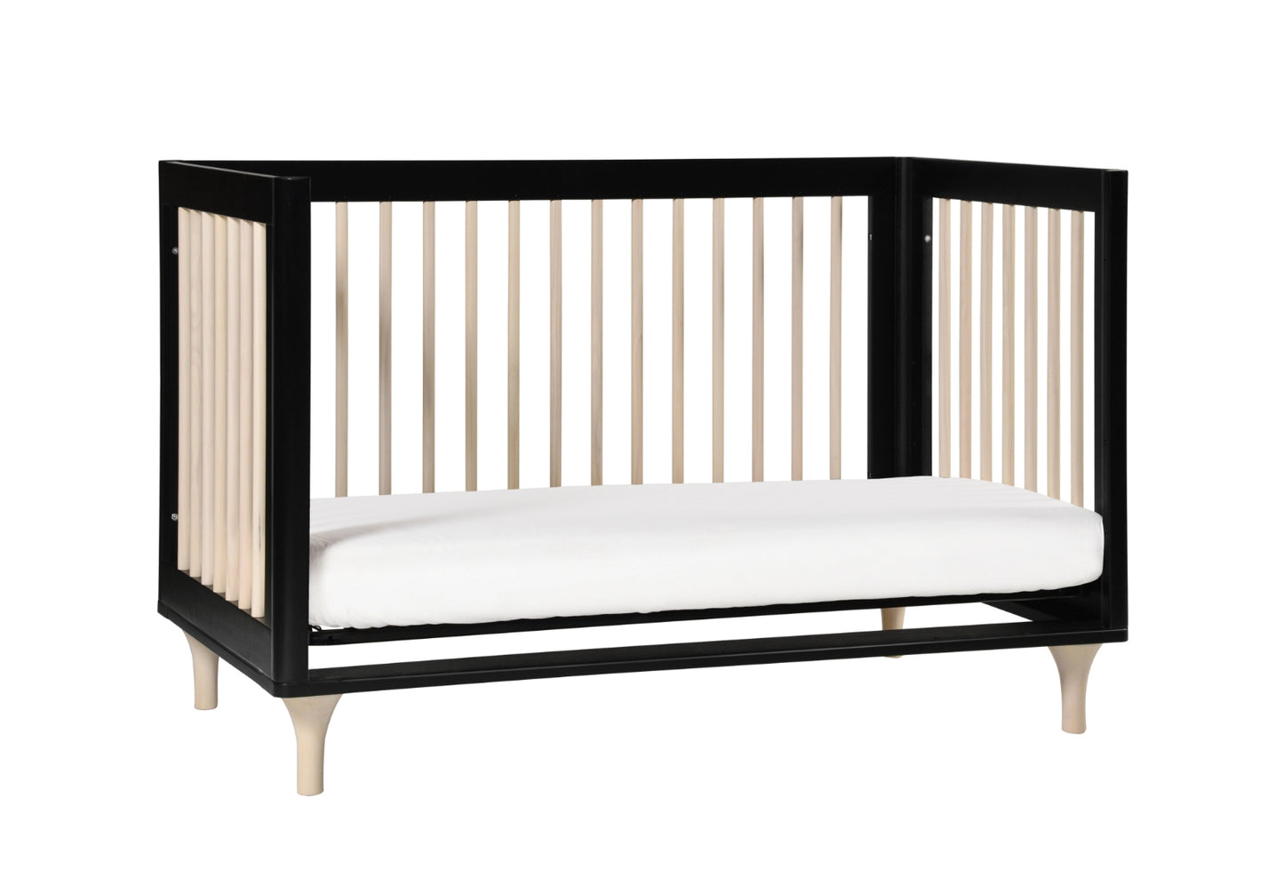 Modern black and white crib with vertical slats and a white mattress on a plain background.