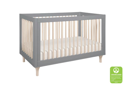 Gray modern baby crib with wooden legs, featuring a GREENGUARD Gold certified logo.