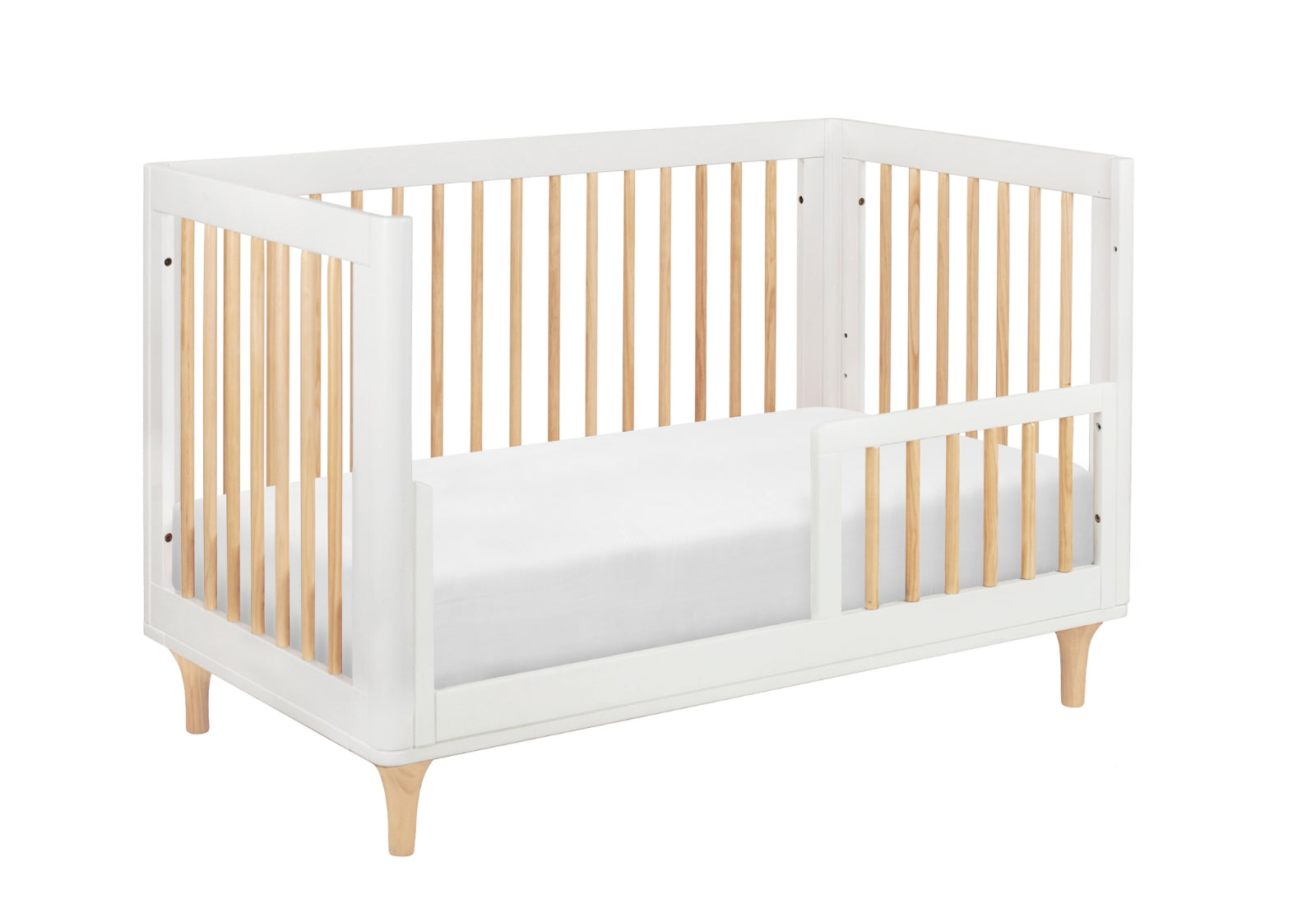 Modern white and natural wood baby crib with a simple, sleek design.