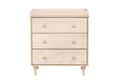 Light wooden nursery dresser with four drawers and rounded knobs on a white background.