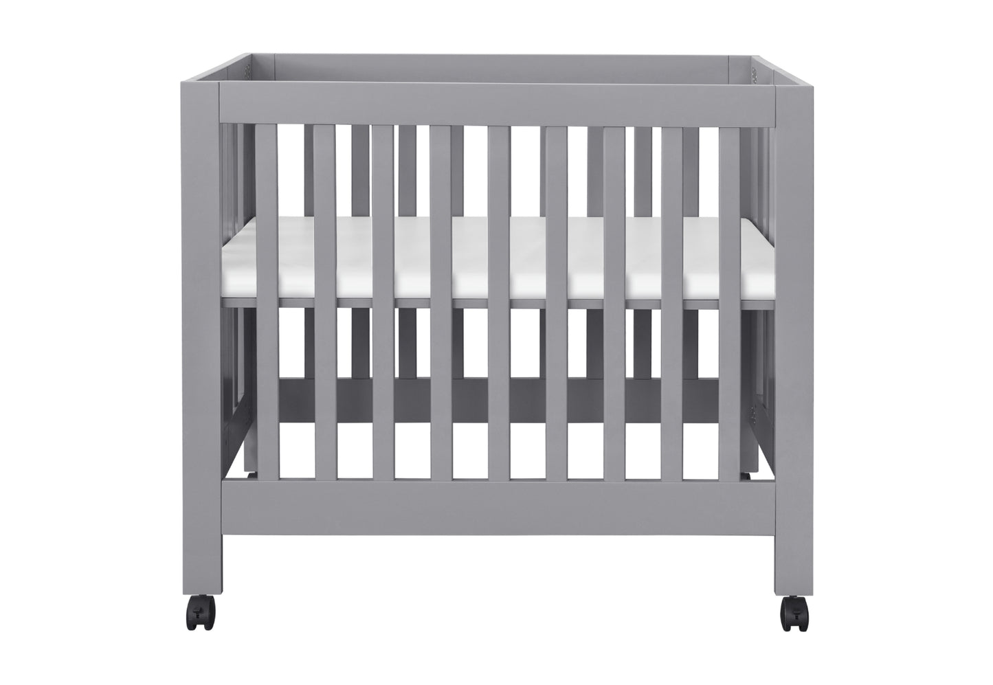 Modern gray baby crib on wheels with a visible white mattress.