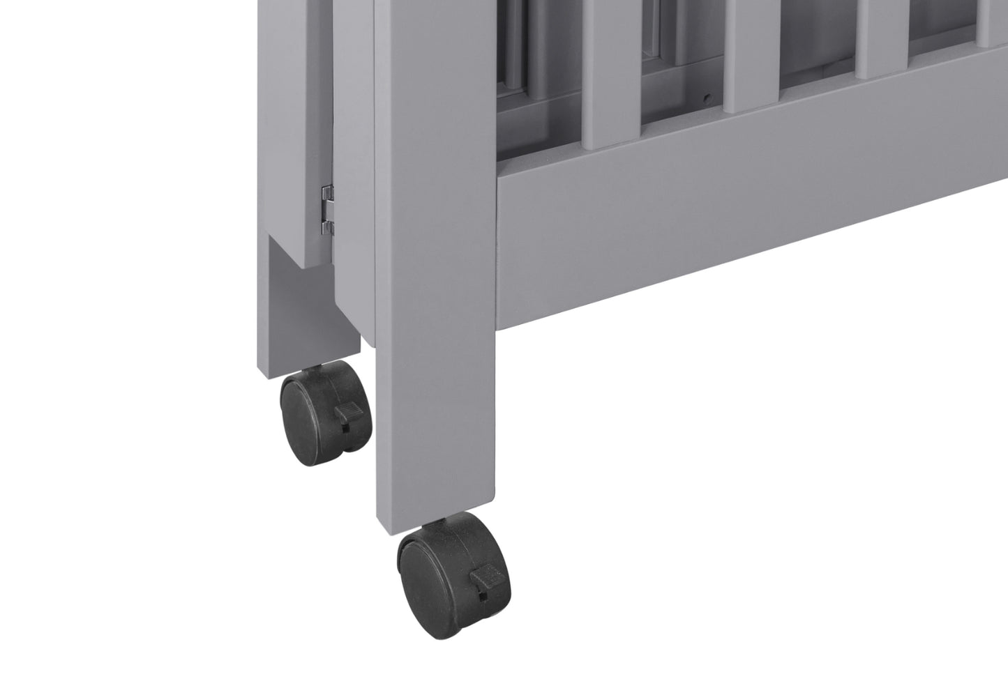 Close-up view of a grey baby crib on wheels, highlighting the mobility feature of the crib design.