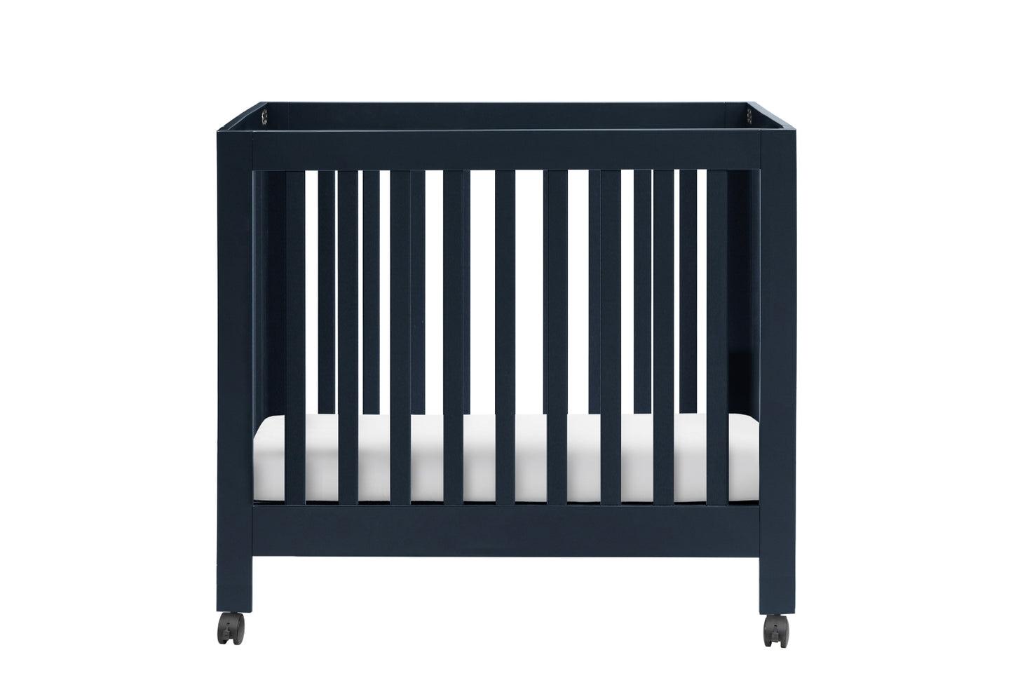 A modern dark blue crib on wheels with a white mattress, isolated on a white background.