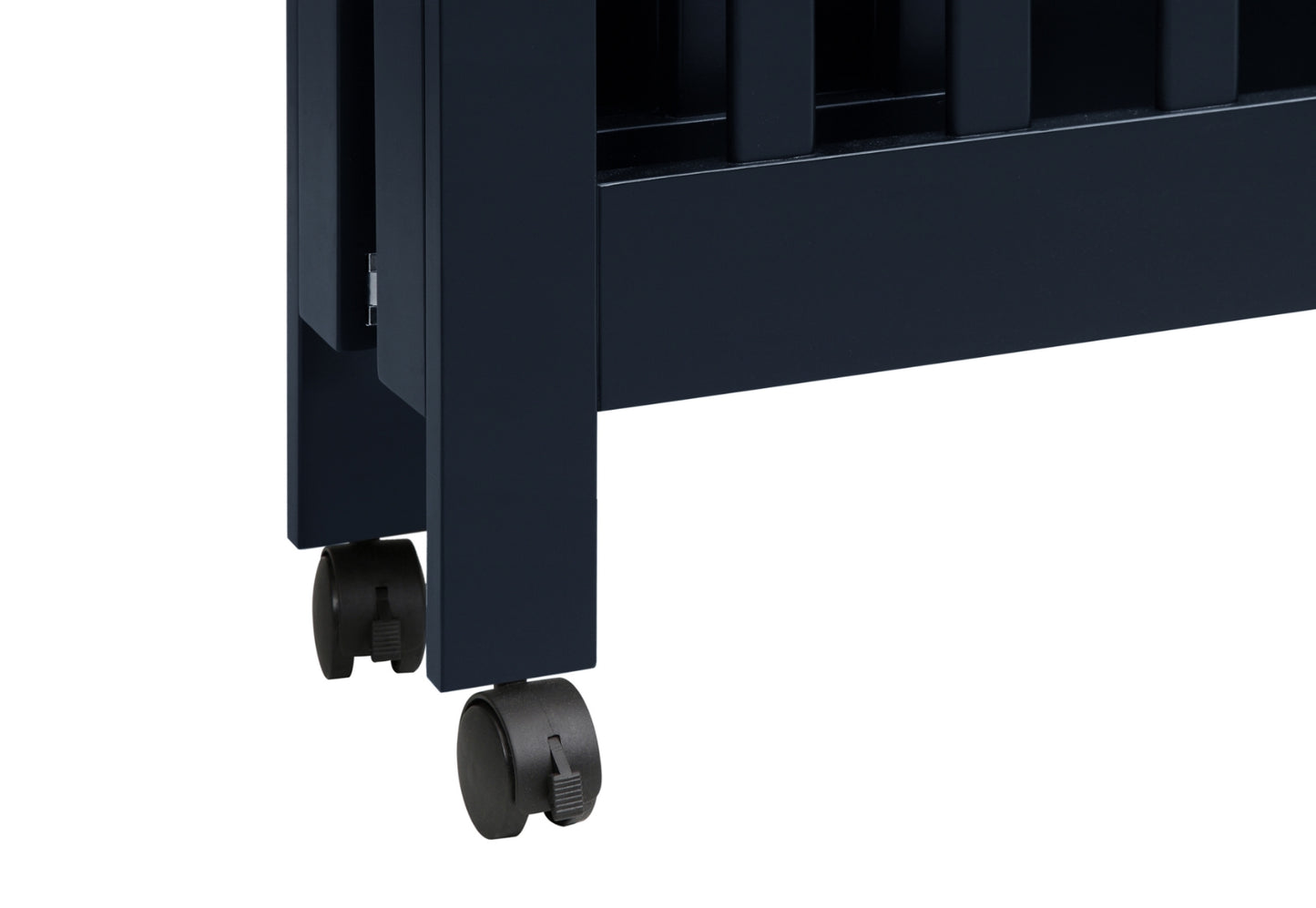 Close-up of a dark blue baby crib's leg showing the detail of its wheels for easy mobility.