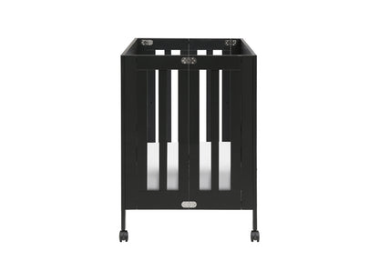 Black wheeled baby crib with visible brand logo at the base, isolated on a white background.