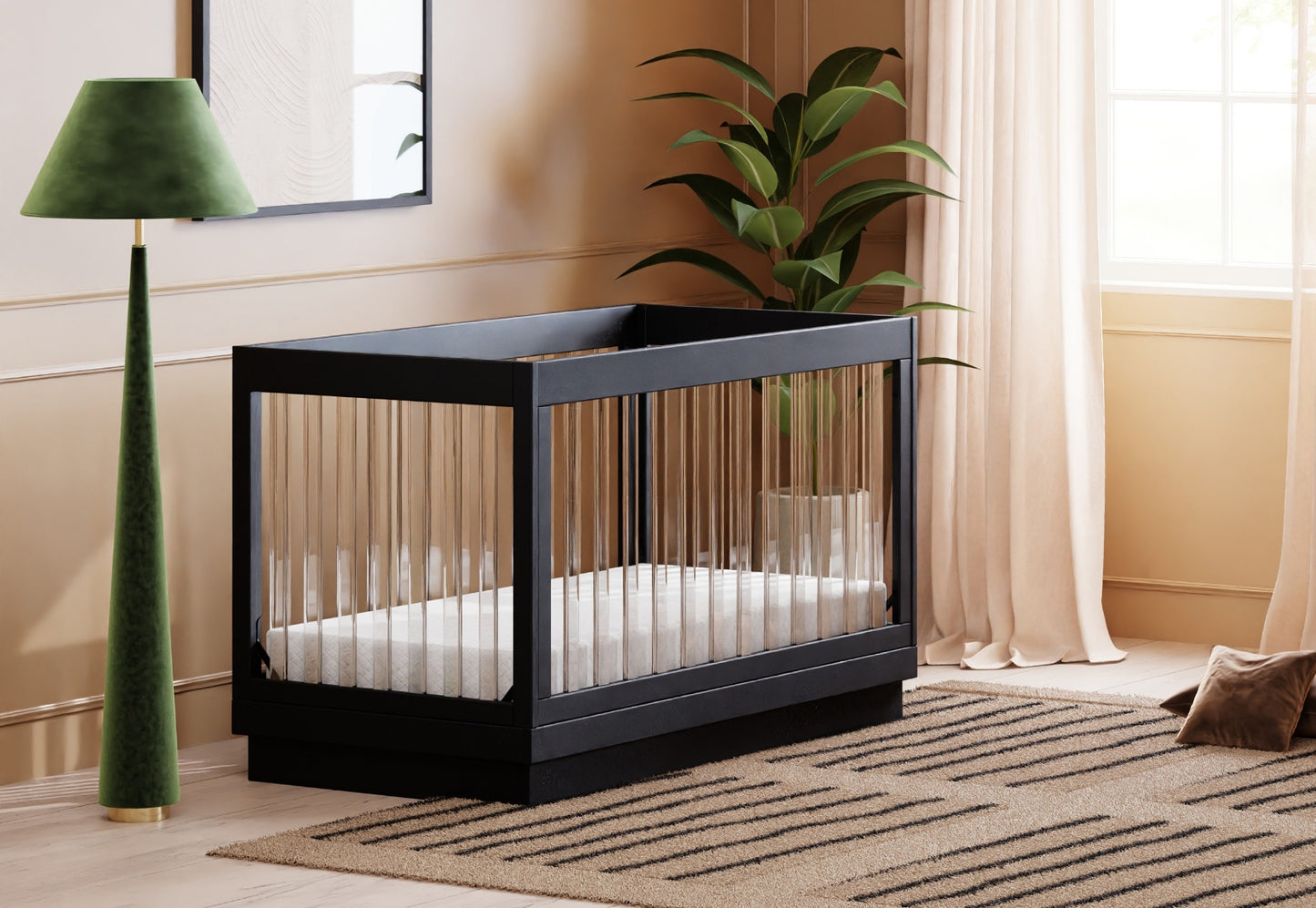 Modern black baby crib in a stylish room with a green lamp and potted plant, showcasing a comfortable and contemporary nursery setting.