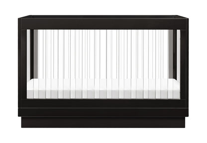 Black modern baby crib with vertical white bars and a white mattress, isolated on a white background.