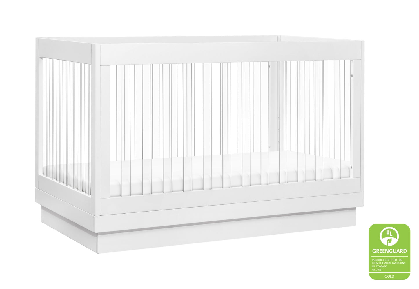 Modern white baby crib featuring a minimalist design and certified as Greenguard Gold for low chemical emissions.