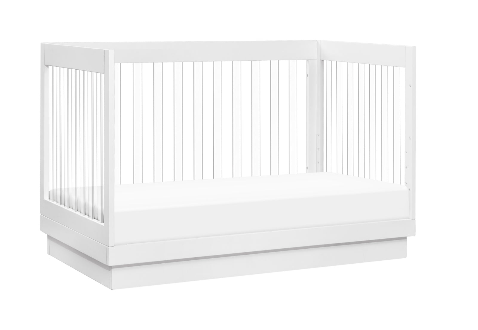 A modern white baby crib featuring a secure slat design and a low-profile base, isolated on a white background.