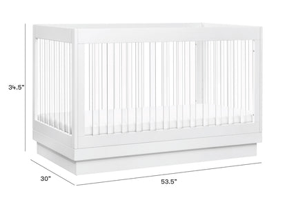 A modern white baby crib with dimensions displayed: 34.5 inches high, 53.5 inches wide, and 30 inches deep.