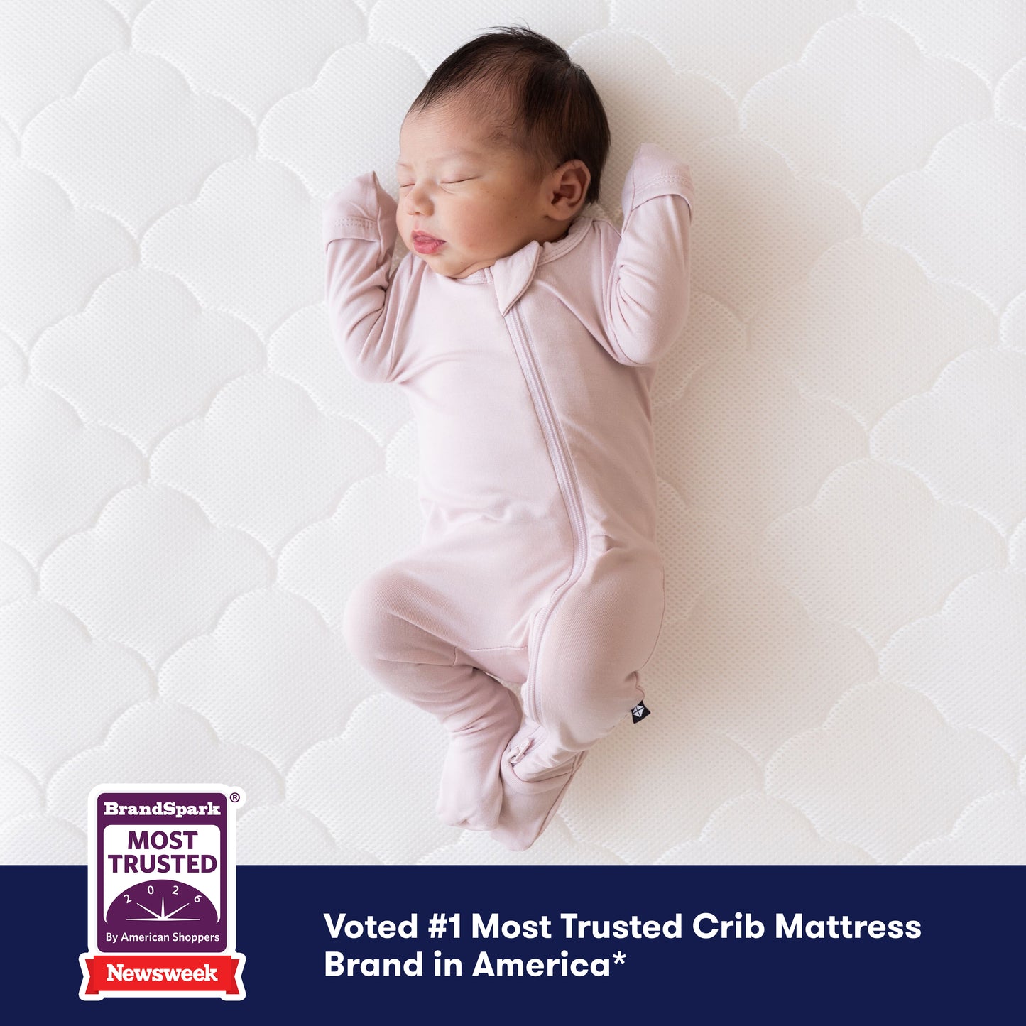A baby in a light pink onesie sleeps on a Newton Baby Crib Mattress, which is breathable and washable. A corner badge states "Most Trusted Crib Mattress Brand in America," citing Newsweek and BrandSpark as sources.