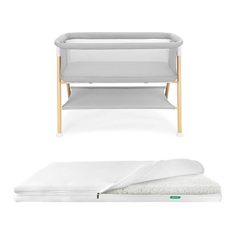 Newton essential bassinet and white newton essential mattress on white background