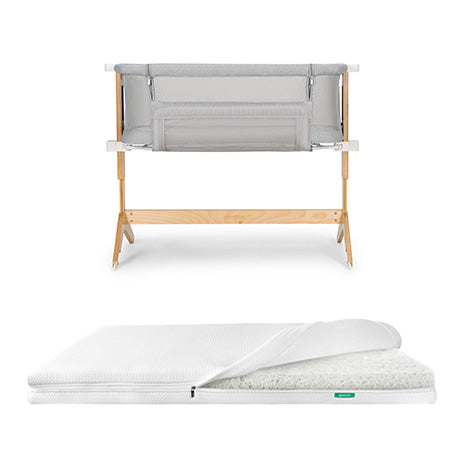 bassinet and bedside sleeper and essential mattress on white background 
