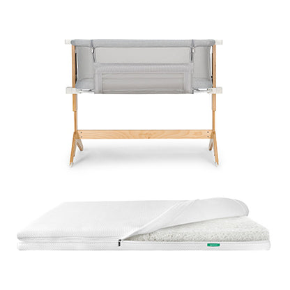 bassinet and bedside sleeper and essential mattress on white background 