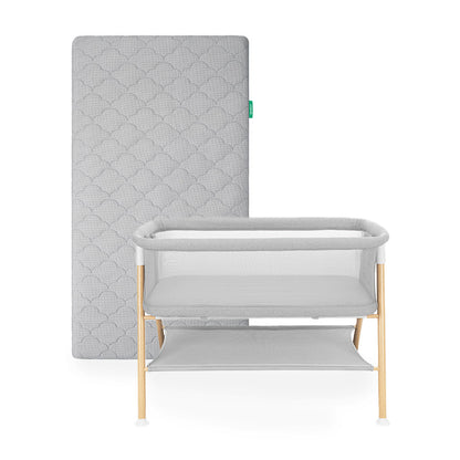 Newton essential bassinet and grey newton original mattress on white background