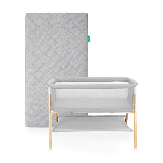 Newton essential bassinet and grey newton original mattress on white background