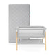 Newton essential bassinet and grey newton original mattress on white background