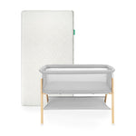 Newton waterproof mattress next to essential bassinet on a white background 1001-wht-8401
