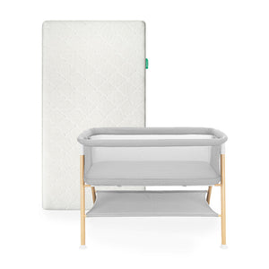 Newton waterproof mattress next to essential bassinet on a white background 1001-wht-8401