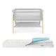 Newton waterproof mattress next to essential bassinet on a white background