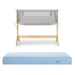 The Bundle 3 BFCM by Newton Baby features a wooden-framed, breathable bassinet with mesh sides, displayed above a light blue, quilted, washable crib mattress on a white background.