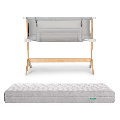 The Newton Baby Bundle 3 BFCM includes a wooden-framed bedside sleeper with light gray mesh sides and a matching rectangular, quilted, washable crib mattress, both displayed against a white background.