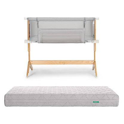 The Newton Baby Bundle 3 BFCM includes a wooden-framed bedside sleeper with light gray mesh sides and a matching rectangular, quilted, washable crib mattress, both displayed against a white background.