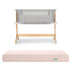 The Newton Baby Bundle 3 BFCM features a breathable bassinet with mesh sides and grey fabric, paired with a light pink quilted washable crib mattress, both shown on a white background.