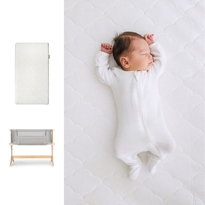 A newborn in a white onesie sleeps on the Newton Baby Bundle 3 BFCM. On the left is a top view of the mattress; below, a gray breathable bassinet with wooden legs. 1000-WHT-8400 