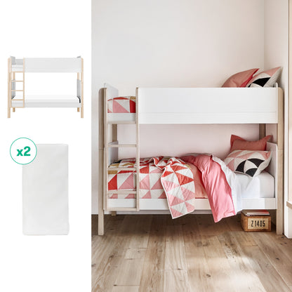 The Newton Baby Tip Toe Bunk Bed & Kids' Twin Mattress Bundle features white panels and geometric pink and white bedding, set against a light wall and wooden floor. Includes two plain Kids' Twin Mattresses.