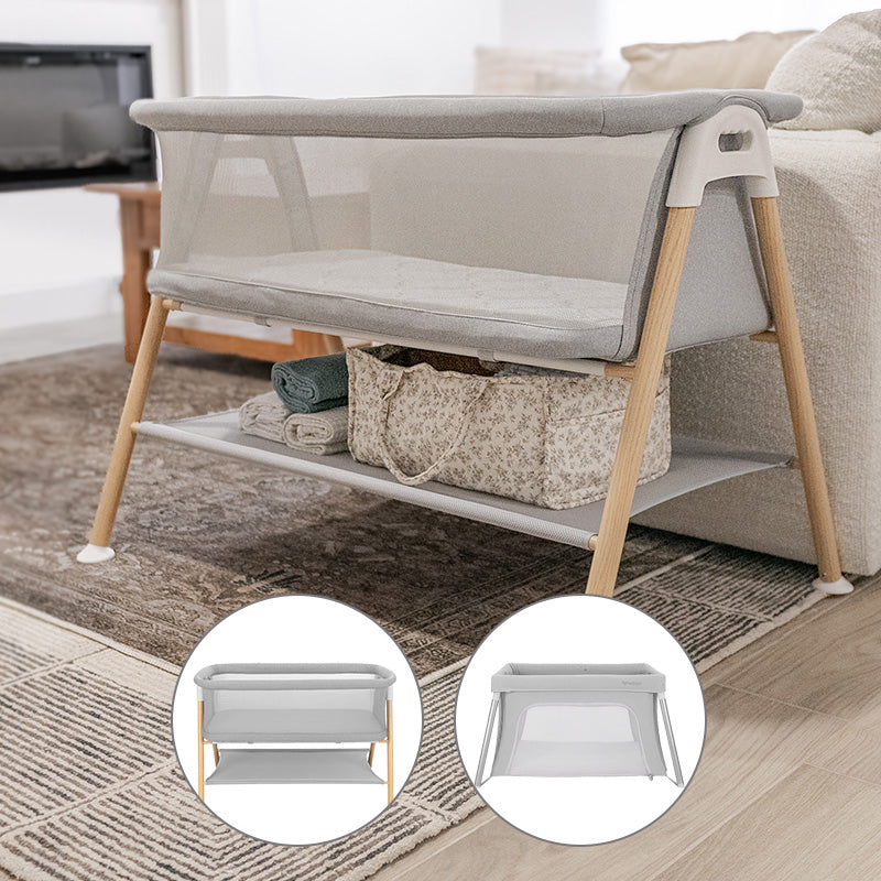 The Newton Baby Bundle 4 BFCM bassinet, featuring modern gray fabric and wooden legs, sits by a sofa on a patterned rug with a storage basket beneath. Inset images display front and side views of the bassinet on a white background.