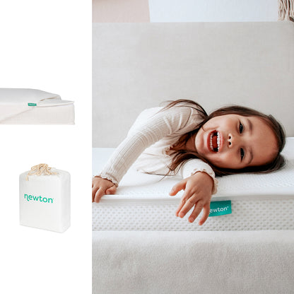 A smiling child lays on a Newton Baby Bundle 1 BFCM mattress with a textured white cover and green tag. Also shown: a folded mattress, a white Newton Baby carrying bag, and a close-up of the mattress corner.