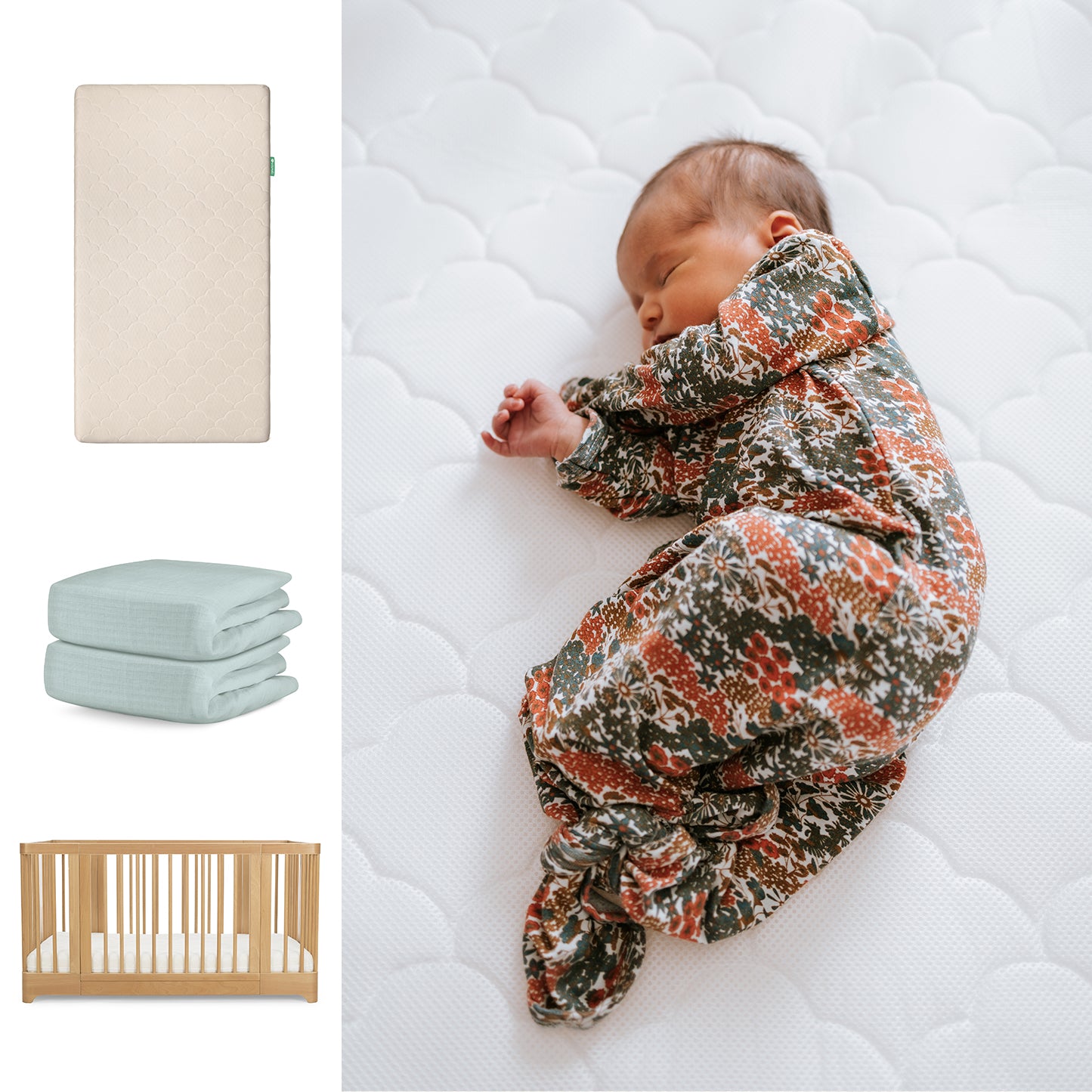 A baby in a floral sleeper lies on a Newton Baby Nest Convertible Crib with the Original Mattress and breathable organic cotton sheets; folded blue blankets and a beige mattress are also visible. 111-8420-NAT-1000-SAN-SNS
