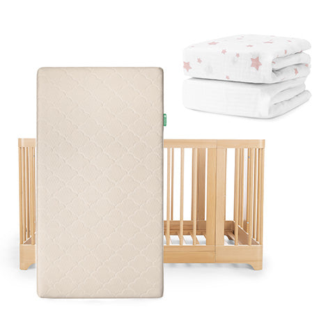 The Newton Baby Nest Convertible Crib, Original Mattress, and two Breathable Organic Cotton Sheets—one white, one white with pink stars—are shown against a white background.