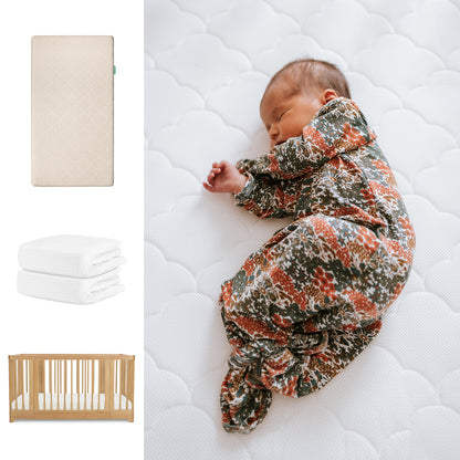 A newborn in a floral onesie sleeps on a white Newton Baby Original Mattress. Nearby images feature the Newton Baby Nest Convertible Crib, breathable organic cotton sheets, and a wooden crib, all part of the Nest Convertible Crib set. 111-8420-NAT-1000-SAN-WNW