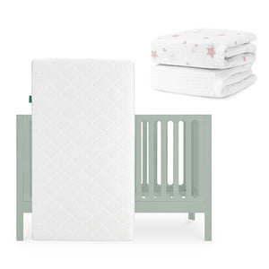 The Newton Baby Galileo Crib, Original Crib Mattress, and Sheets set is shown in light green, with breathable organic cotton sheets featuring pink stars displayed folded in the background. skip