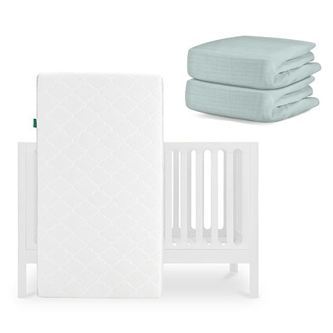 The Newton Baby Galileo Crib, Original Crib Mattress, and two light blue Breathable Organic Cotton Sheets are displayed together on a white background. skip
