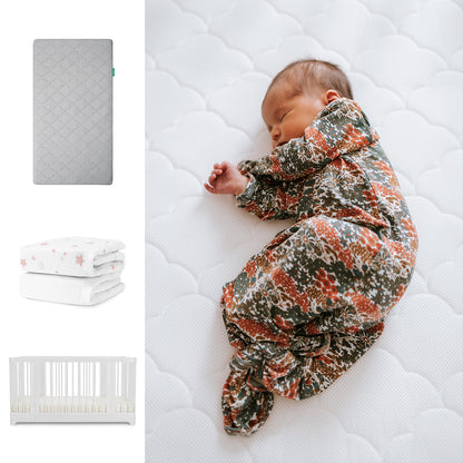A newborn sleeps on the Newton Baby Nest Convertible Crib with the Original Mattress and breathable organic cotton sheets; separate images show the grey mattress, folded patterned blankets, and the crib. 111-8420-WHT-1000-GRY-PSW