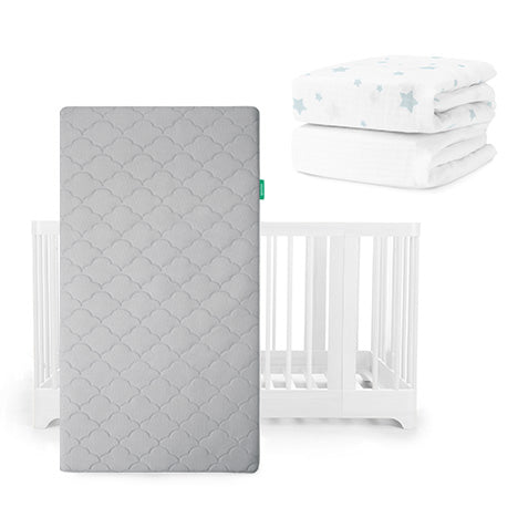 The Newton Baby Nest Convertible Crib, Original Mattress in gray, and two folded Breathable Organic Cotton Sheets with blue stars are displayed together on a white background.