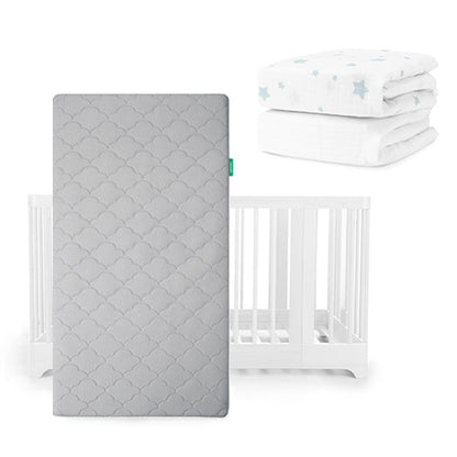 The Newton Baby Nest Convertible Crib, Original Mattress in gray, and two folded Breathable Organic Cotton Sheets with blue stars are displayed together on a white background.
