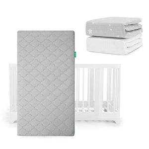 A Newton Baby Nest Convertible Crib with the Original Mattress is shown, topped with star-patterned bedding and a Breathable Organic Cotton Sheet on display.