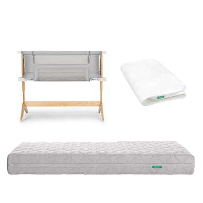 The Newton Baby Bundle 6 BFCM features a modern bassinet with a light wood frame, folded white sheet, and quilted gray mattress, all shown on a white background.