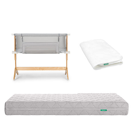 The Newton Baby Bundle 6 BFCM features a modern bassinet with a light wood frame, folded white sheet, and quilted gray mattress, all shown on a white background.