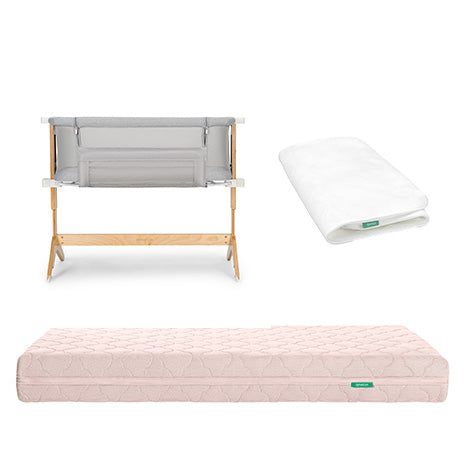 The Newton Baby Bundle 6 BFCM includes a gray and wood bassinet, a folded white sheet, and a pink quilted mattress, all shown against a white background.