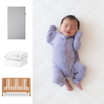A newborn in a lavender onesie sleeps on the Newton Baby Galileo Crib with the Original Crib Mattress and breathable organic cotton sheets. At left are images of a gray mattress, folded pink-star blanket, and the 3-in-1 convertible crib. 111-8420-CST-1000-GRY-PSW
