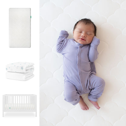 A newborn in a lavender onesie sleeps on the Newton Baby Galileo Crib with the Original Crib Mattress & star-patterned organic cotton sheets, shown alongside images of the convertible crib, mattress, and folded sheet. 111-8420-WHT-1000-WHT-SDW
